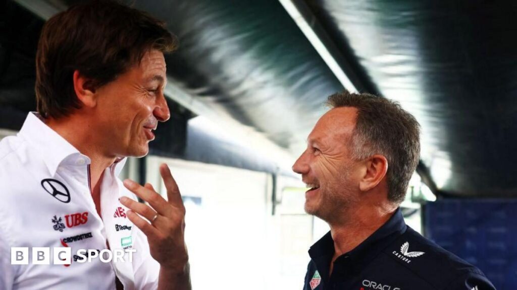 Toto Wolff and Christian Horner standing in the Formula 1 paddock