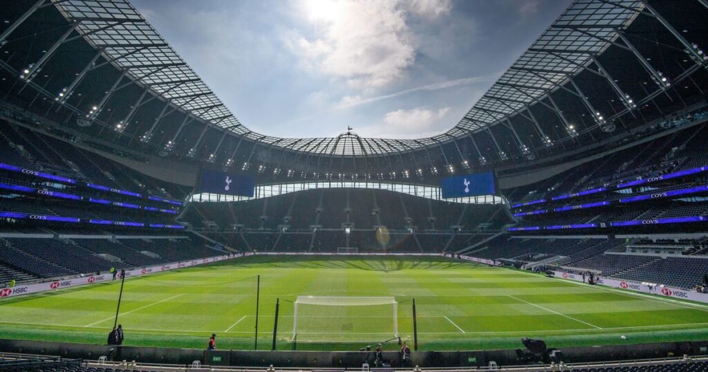 The Tottenham Hotspur stadium exterior and club crest on a matchday