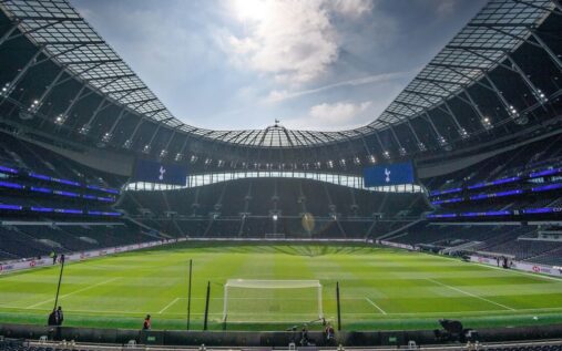 The Tottenham Hotspur stadium exterior and club crest on a matchday
