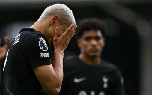 Tottenham Hotspur's stadium exterior showing the club crest on a matchday