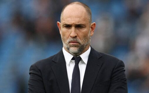 Roberto De Zerbi standing on the touchline during a Premier League match