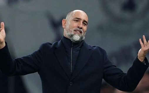 Dejected Tottenham players walking off the pitch past empty seats at the Tottenham Hotspur Stadium