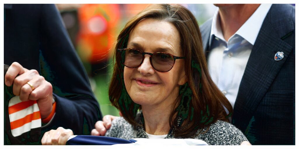 Exterior view of the Tottenham Hotspur Stadium featuring the club crest