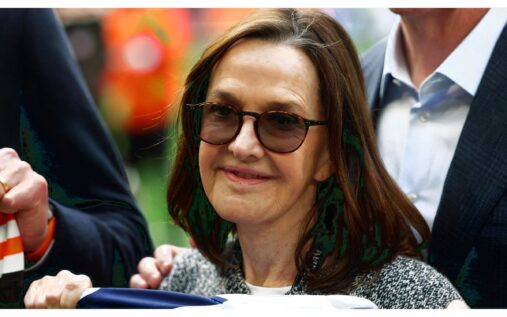 Exterior view of the Tottenham Hotspur Stadium featuring the club crest