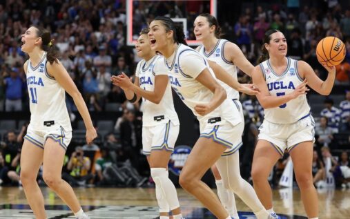 UCLA Bruins players celebrating on the basketball court during the NCAA tournament