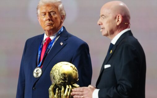 Armed security personnel patrolling outside a major stadium ahead of the World Cup