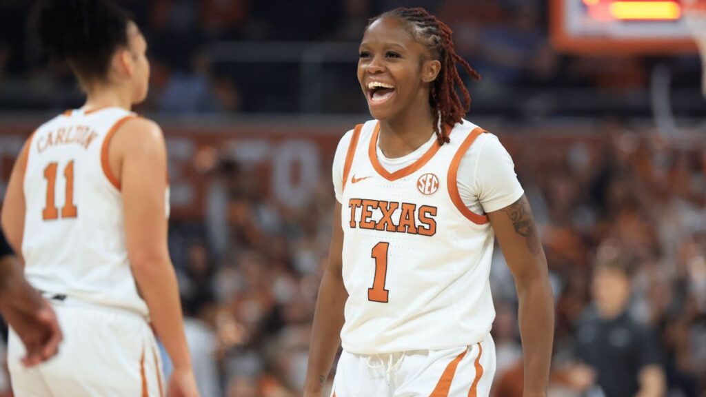 UConn Huskies women's basketball players celebrating on court during the NCAA tournament