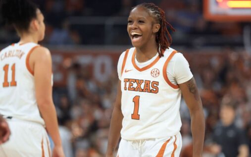 UConn Huskies women's basketball players celebrating on court during the NCAA tournament