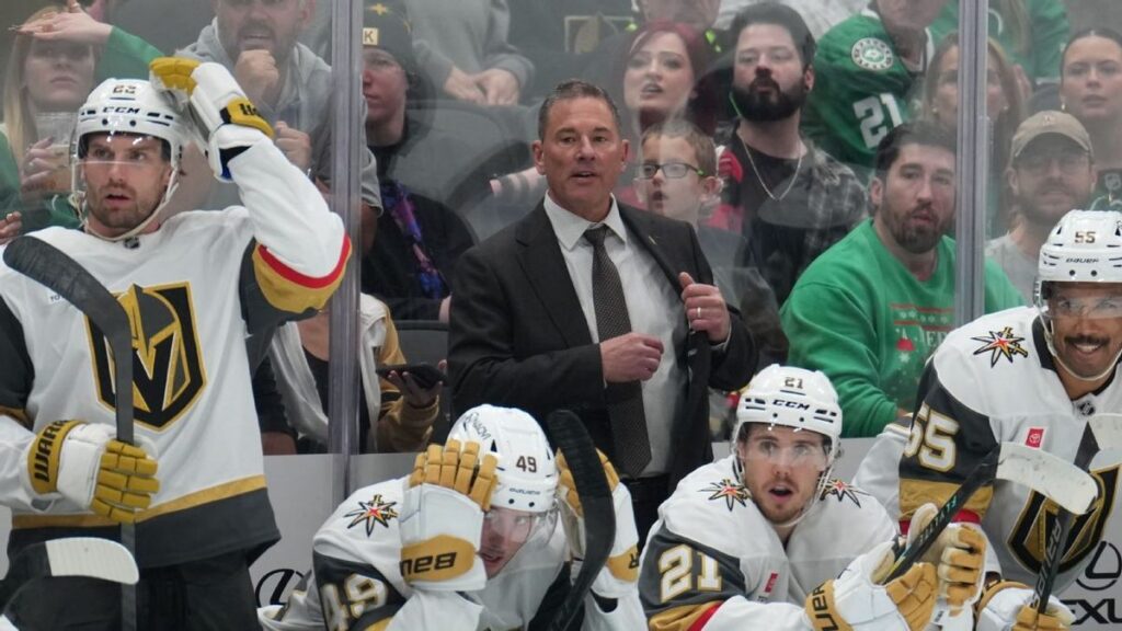 John Tortorella looking on from the bench during an NHL game