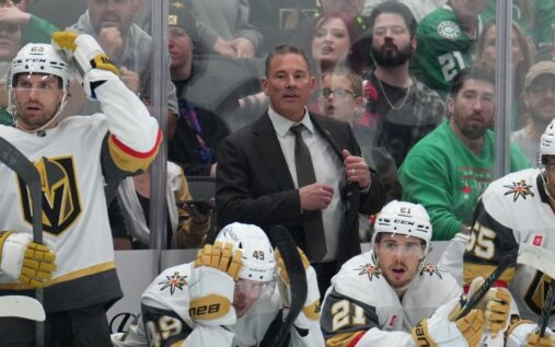 John Tortorella looking on from the bench during an NHL game