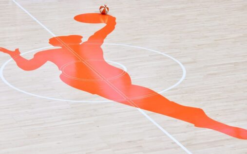 WNBA basketball game action showing players competing on the court