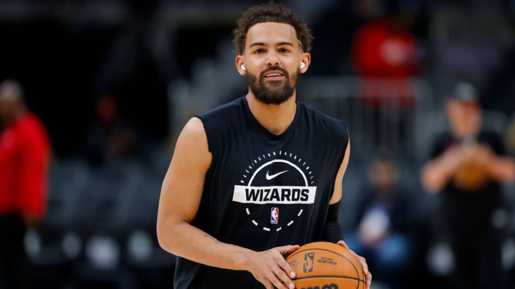 Trae Young warming up on the court in Washington Wizards training gear