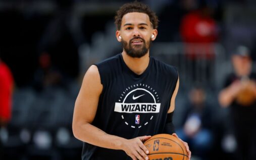 Trae Young warming up on the court in Washington Wizards training gear