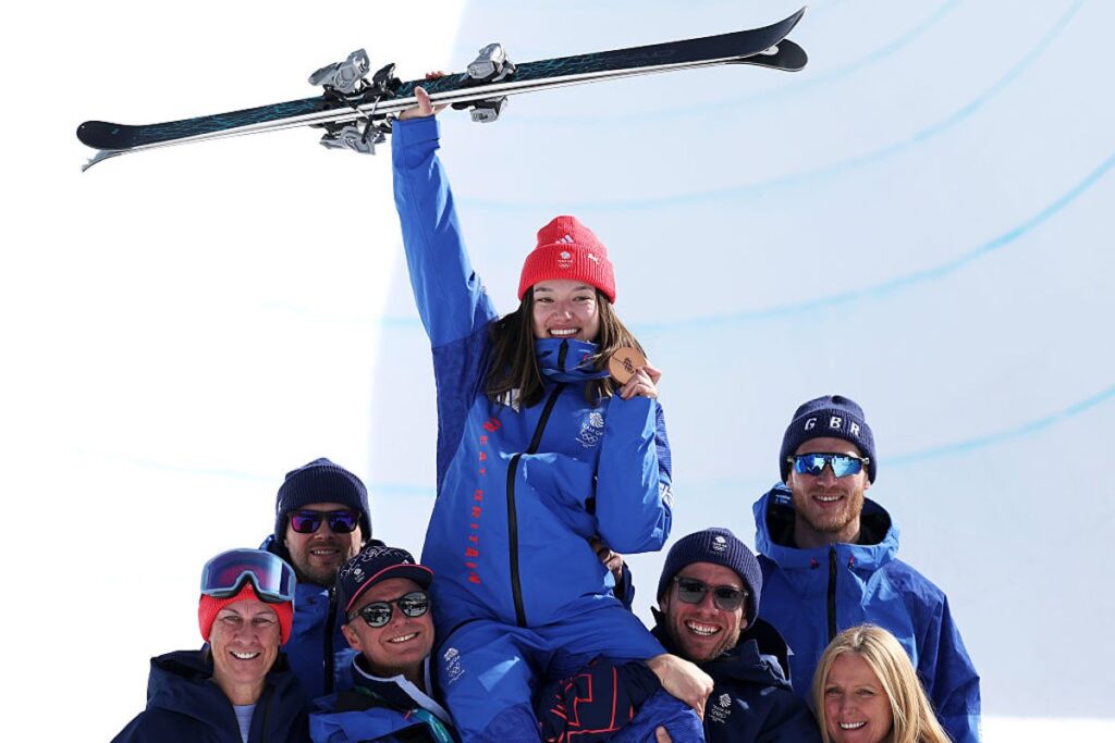 Zoe Atkin performing a trick high above the halfpipe during the Winter Olympics freestyle skiing final