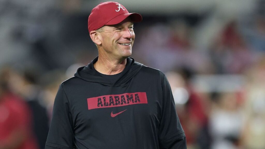 Alabama head football coach Kalen DeBoer looking on from the sidelines during a game