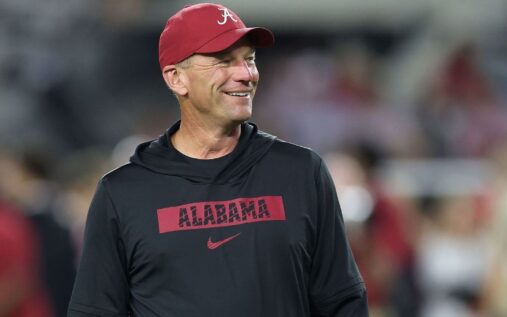 Alabama head football coach Kalen DeBoer looking on from the sidelines during a game