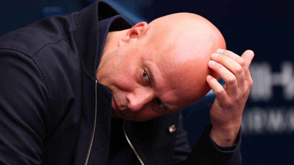 Liverpool manager Arne Slot looking concerned on the touchline during a Premier League match