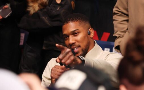 Anthony Joshua preparing for a boxing match inside the ring