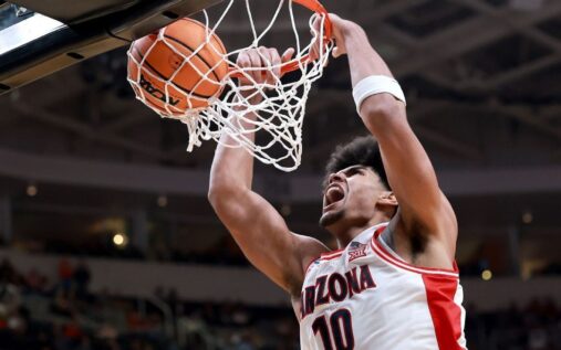 Arizona Wildcats head coach Tommy Lloyd directing his players during a college basketball game