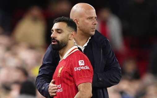 Liverpool manager Arne Slot and forward Mohamed Salah talking on the pitch