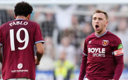 Manchester City and Arsenal players competing in a high-stakes Premier League match