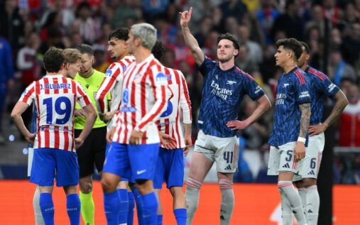 Arsenal players reacting to the referee's VAR decision during the Champions League match against Atletico Madrid