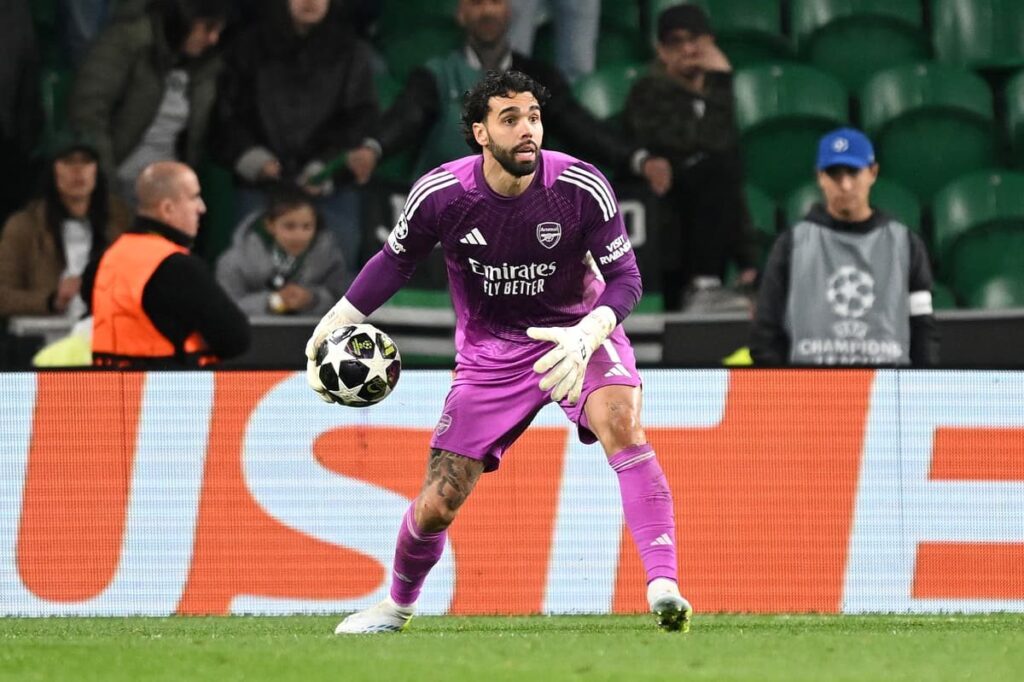 Arsenal goalkeeper David Raya making a vital save during a Champions League match