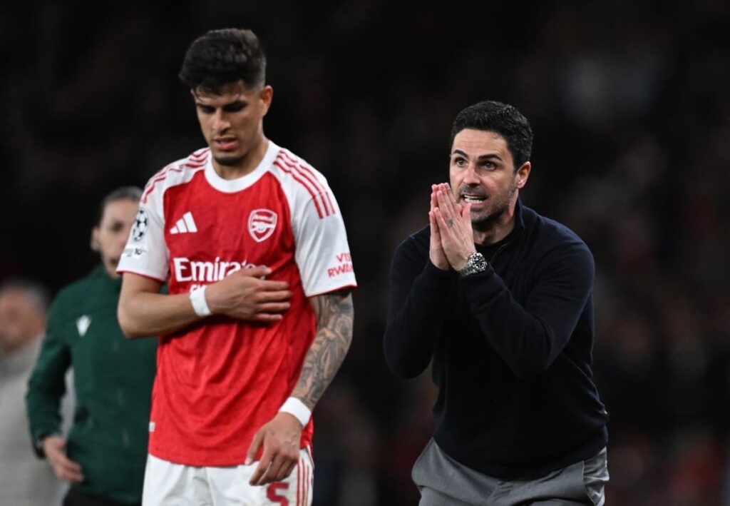 Arsenal manager Mikel Arteta looking concerned on the touchline during a Champions League fixture.