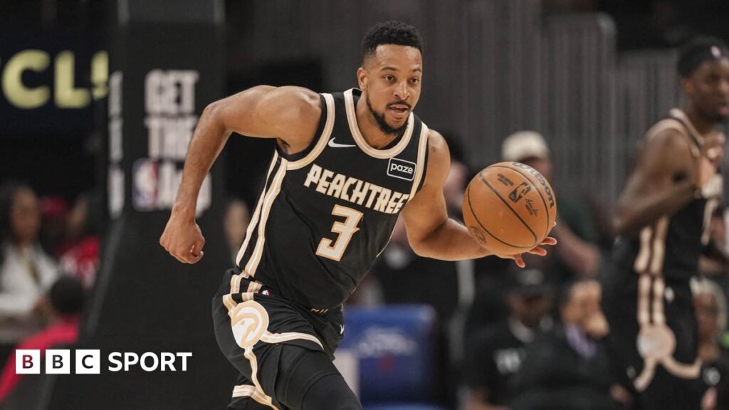 Atlanta Hawks players celebrate securing their NBA play-off spot and the Southeast Division title on the court.