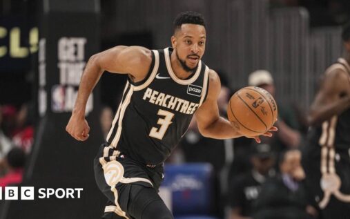 Atlanta Hawks players celebrate securing their NBA play-off spot and the Southeast Division title on the court.