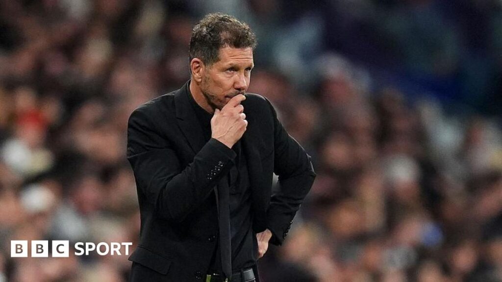 Atletico Madrid manager Diego Simeone standing thoughtfully on the touchline during a La Liga match