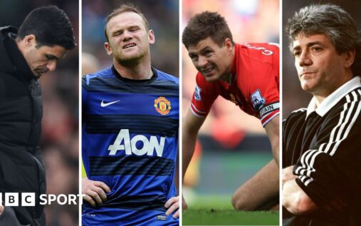 A dejected Premier League footballer reacting with hands on his head to a missed opportunity on the pitch