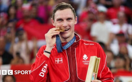 Viktor Axelsen of Denmark competing on the badminton court