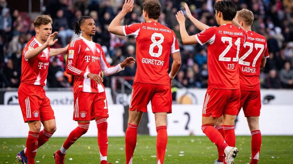 Bayern Munich players celebrating a record-breaking goal during their 5-0 win over St. Pauli