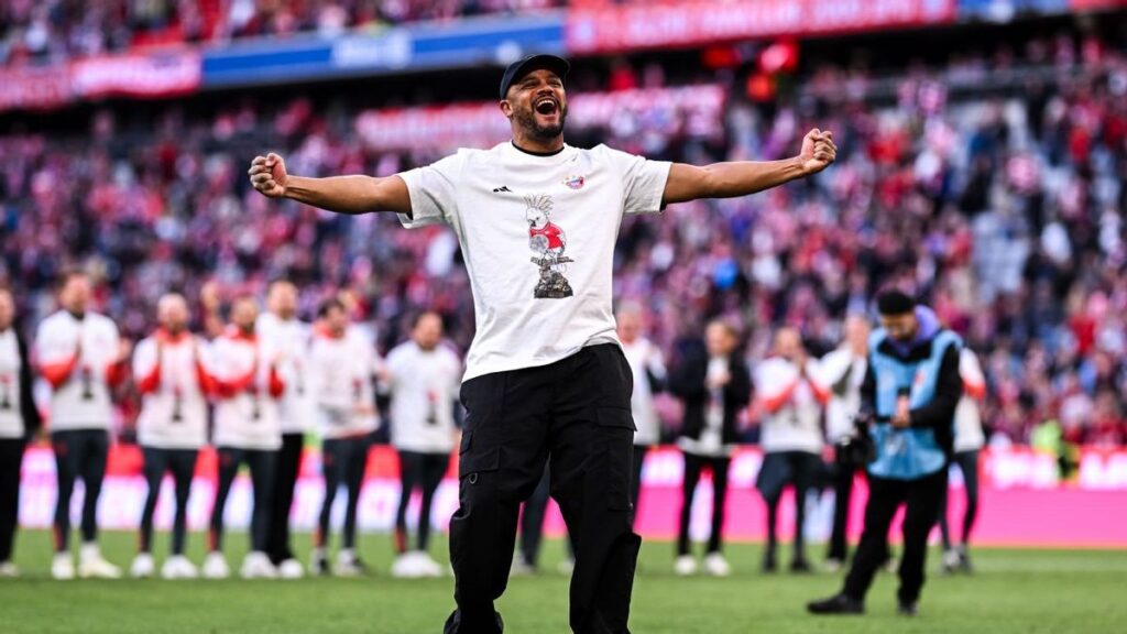 Bayern Munich manager Vincent Kompany celebrating the Bundesliga title win with his players on the pitch
