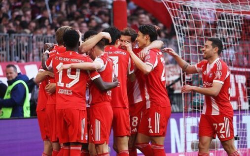 Bayern Munich players celebrating their Bundesliga title victory on the pitch