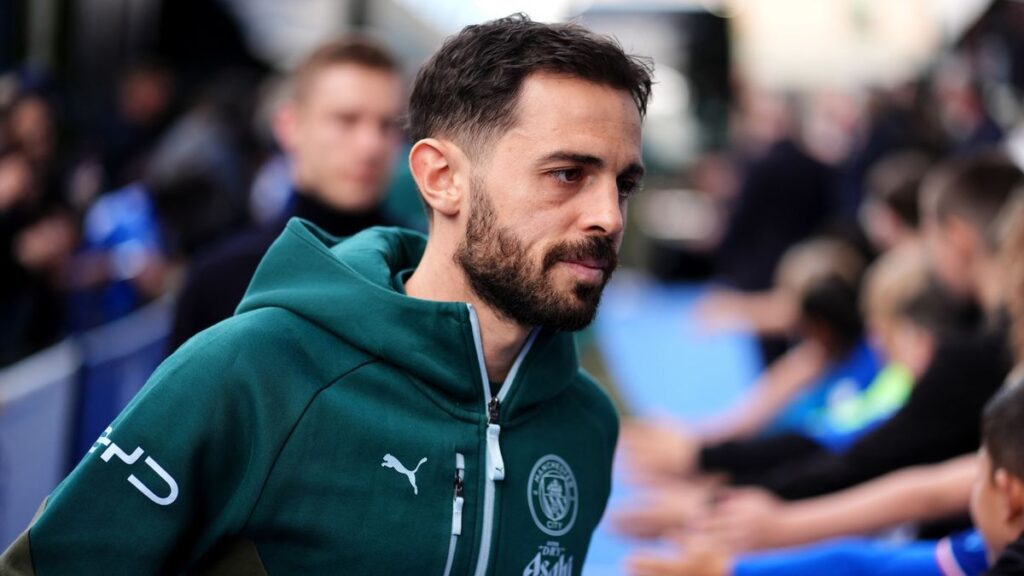 Bernardo Silva applauding the Manchester City fans on the pitch