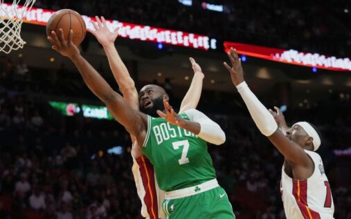 Jayson Tatum and Jaylen Brown of the Boston Celtics celebrating on the basketball court