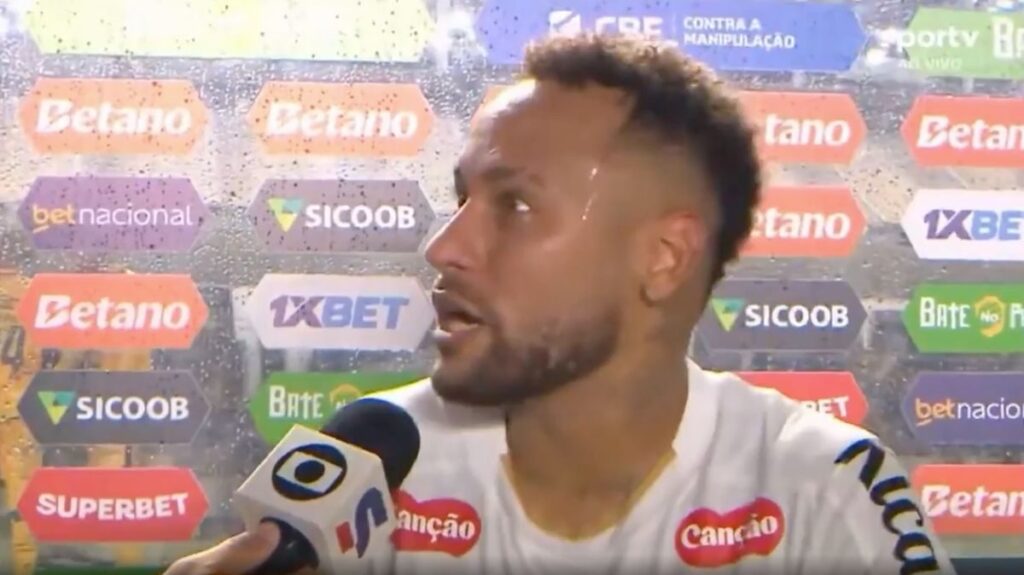 Neymar looking frustrated in a Santos jersey during a football match