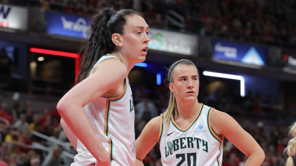 Breanna Stewart and Sabrina Ionescu smiling together in New York Liberty basketball uniforms