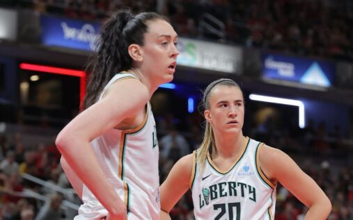 Breanna Stewart and Sabrina Ionescu smiling together in New York Liberty basketball uniforms