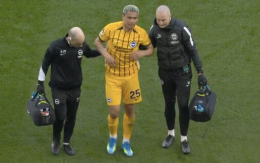 Brighton midfielder Diego Gomez receiving medical attention on the pitch