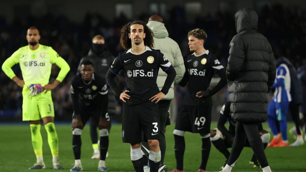 Dejected Chelsea players react to conceding a goal during their 3-0 Premier League defeat to Brighton at the Amex Stadium