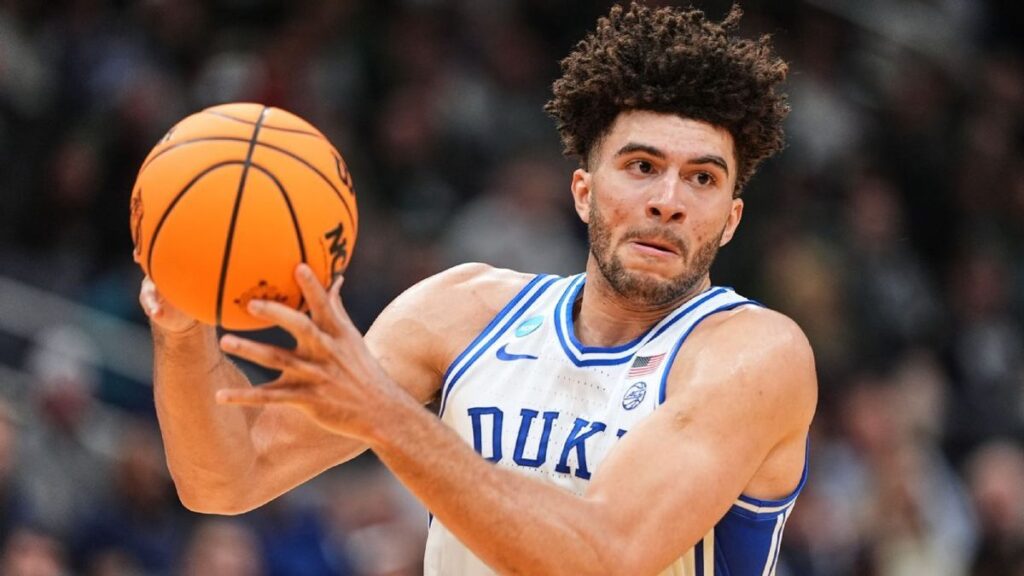 Duke freshman Cameron Boozer dribbling the basketball during an NCAA match