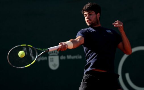 Carlos Alcaraz hitting a forehand on a clay court in Monaco