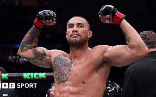 Carlos Ulberg standing in the UFC Octagon preparing for his light-heavyweight title fight against Jiri Prochazka