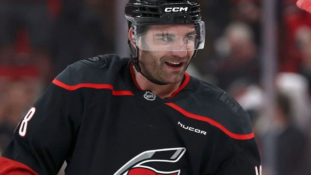 Carolina Hurricanes forward Jordan Martinook celebrating his game-winning goal on the ice