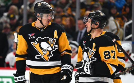 Carolina Hurricanes players compete on the ice during an NHL match