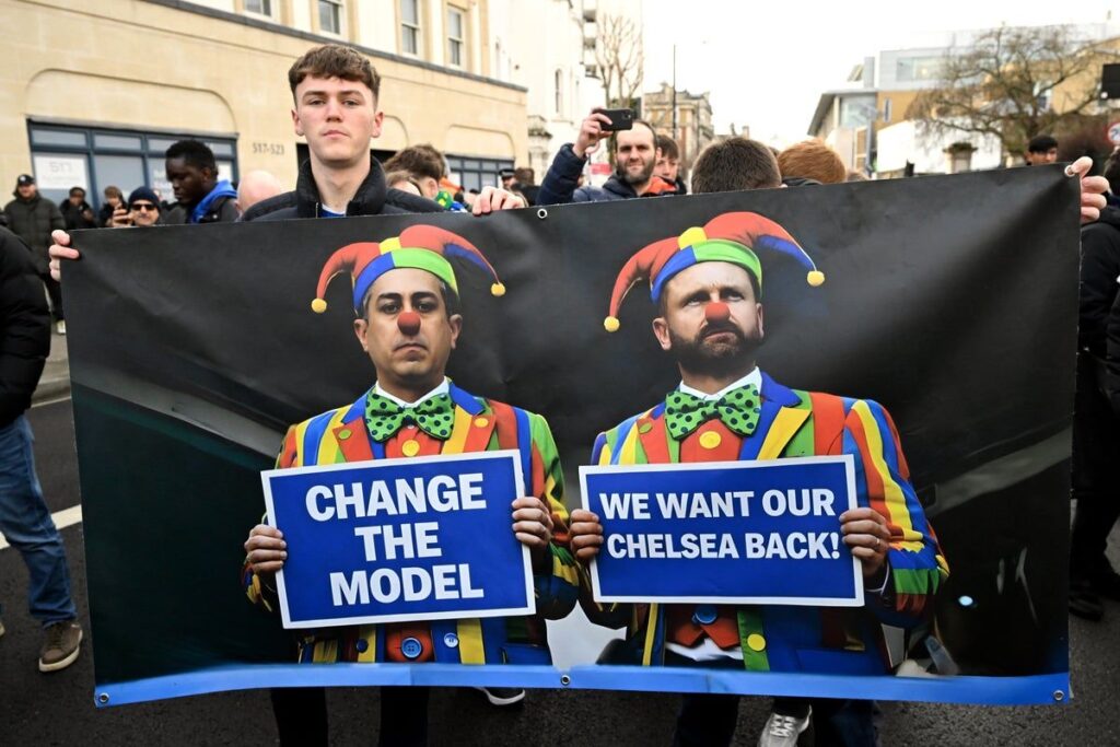 Chelsea fans displaying banners and protesting against the club's ownership at Stamford Bridge