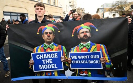 Chelsea fans displaying banners and protesting against the club's ownership at Stamford Bridge